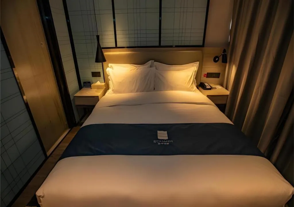 Bed in Echarm Hotel Zibo Gaoqing Zhongcheng Inernational
