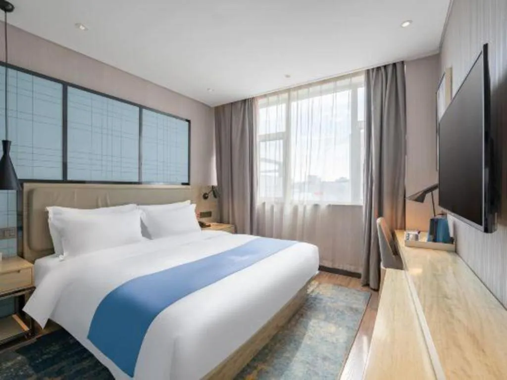 Bed in Echarm Hotel Zibo Gaoqing Zhongcheng Inernational