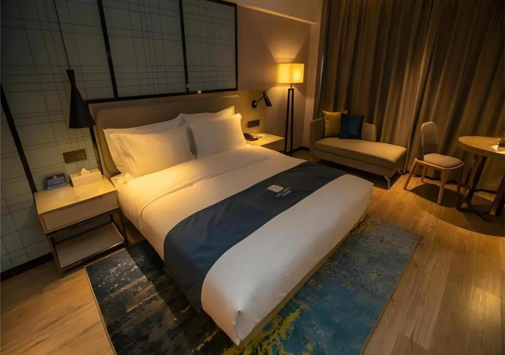 Bed in Echarm Hotel Zibo Gaoqing Zhongcheng Inernational