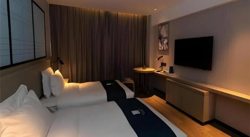 Bed in Echarm Hotel Zibo Gaoqing Zhongcheng Inernational