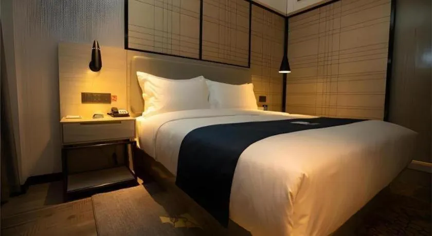 Bed in Echarm Hotel Zibo Gaoqing Zhongcheng Inernational