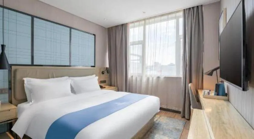 Bed in Echarm Hotel Zibo Gaoqing Zhongcheng Inernational