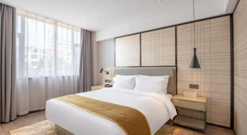 Bed in Echarm Hotel Zibo Gaoqing Zhongcheng Inernational