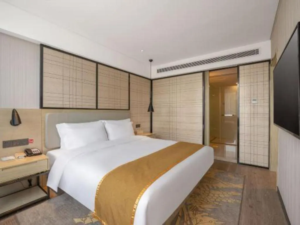 Bed in Echarm Hotel Zibo Gaoqing Zhongcheng Inernational
