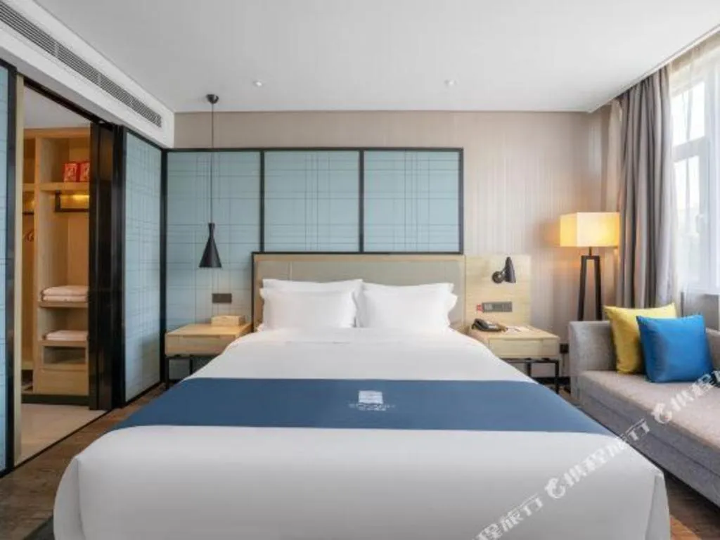 Bed in Echarm Hotel Zibo Gaoqing Zhongcheng Inernational