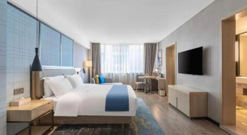 Bed in Echarm Hotel Zibo Gaoqing Zhongcheng Inernational