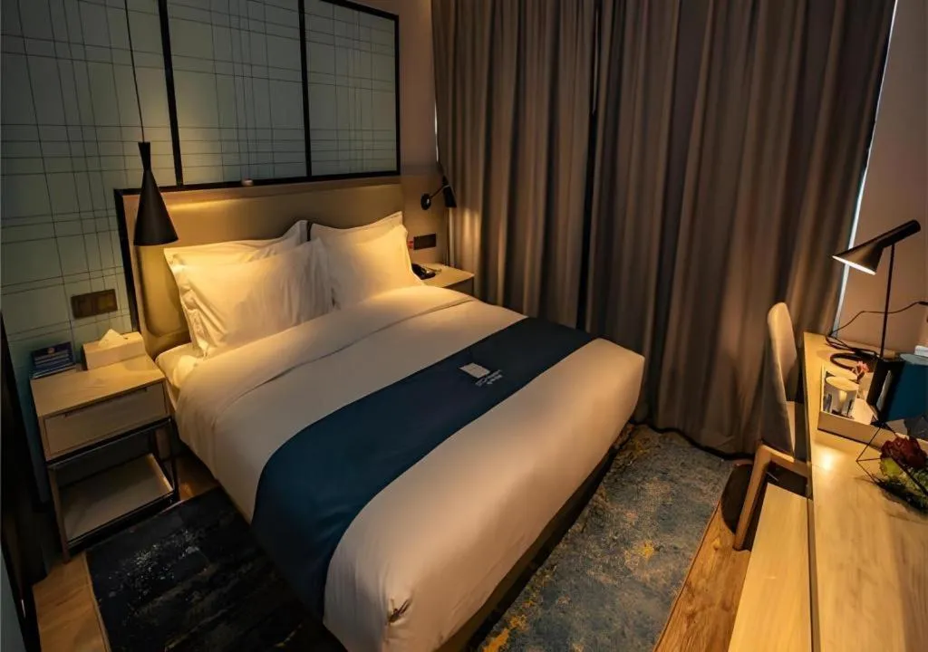 Bed in Echarm Hotel Zibo Gaoqing Zhongcheng Inernational