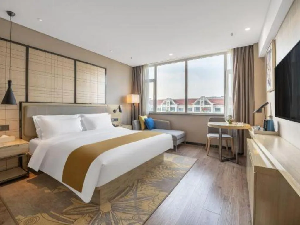 Bed in Echarm Hotel Zibo Gaoqing Zhongcheng Inernational