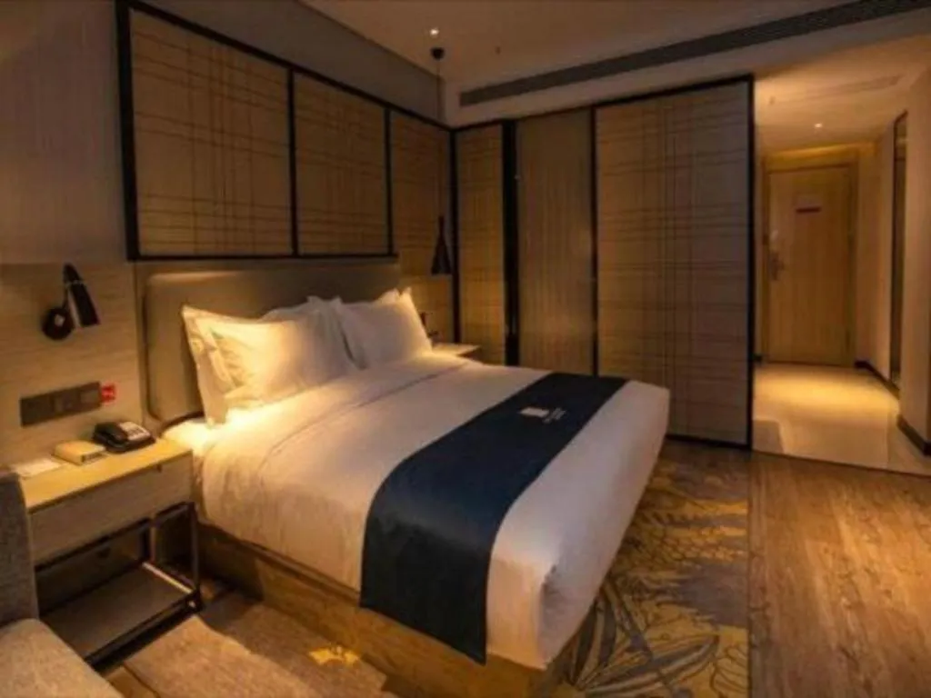 Bed in Echarm Hotel Zibo Gaoqing Zhongcheng Inernational
