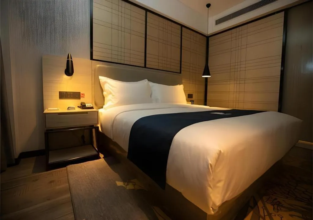 Bed in Echarm Hotel Zibo Gaoqing Zhongcheng Inernational