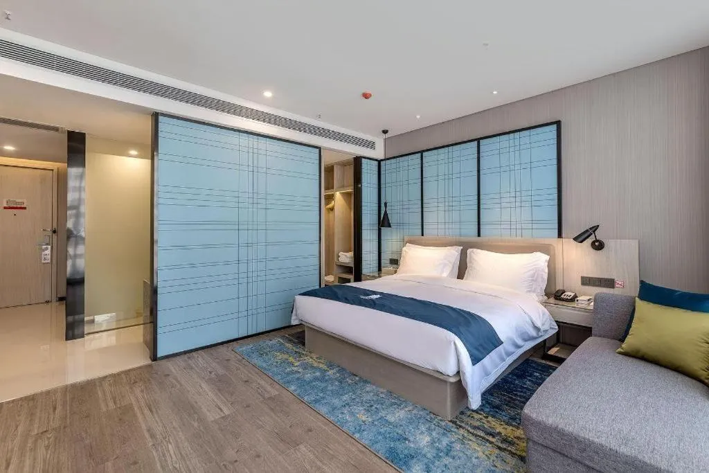 Bed in Echarm Hotel Kunming Railway Station Huancheng South Road Metro Station