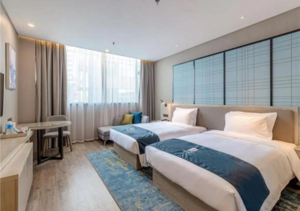 Bed in Echarm Hotel Kunming Railway Station Huancheng South Road Metro Station