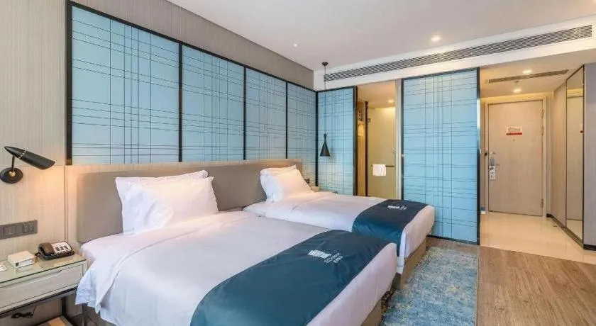 Bed in Echarm Hotel Kunming Railway Station Huancheng South Road Metro Station