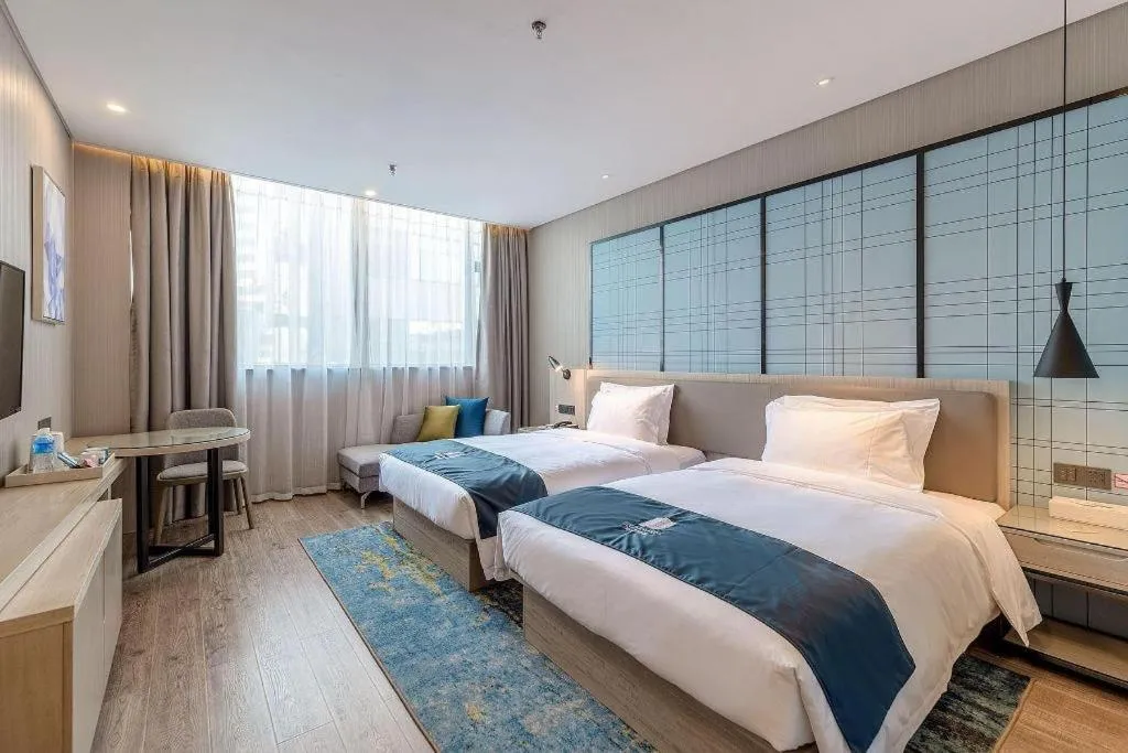 Bed in Echarm Hotel Kunming Railway Station Huancheng South Road Metro Station