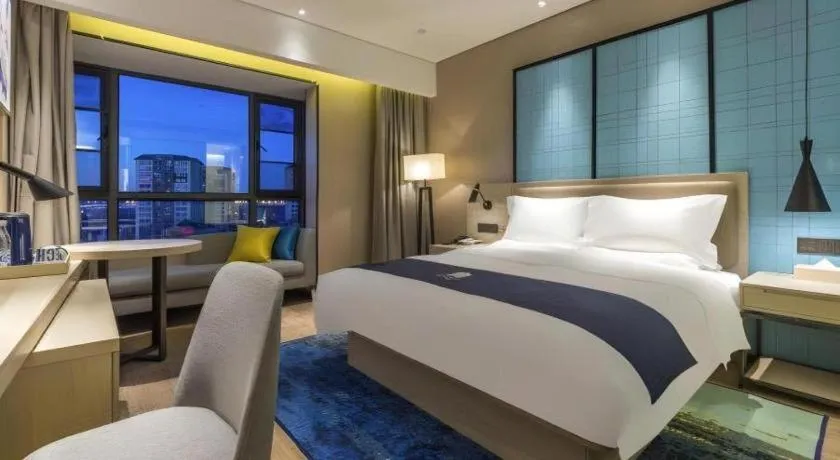 Bed in Echarm Hotel Kunming Railway Station Huancheng South Road Metro Station