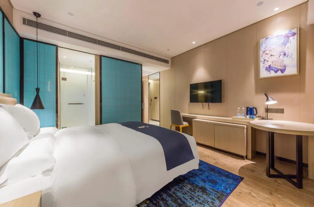 Bed in Echarm Hotel Kunming Railway Station Huancheng South Road Metro Station