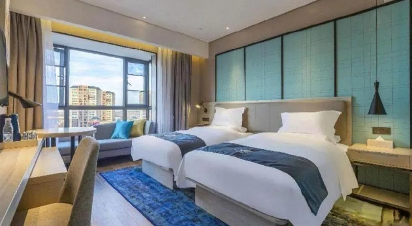 Bed in Echarm Hotel Kunming Railway Station Huancheng South Road Metro Station