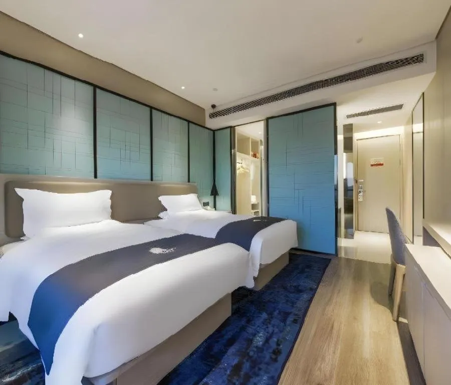 Bed in Echarm Hotel Kunming Railway Station Huancheng South Road Metro Station