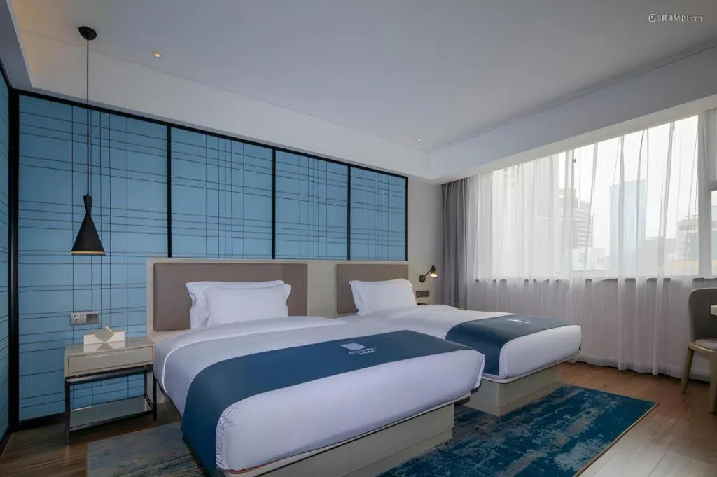 Bed in Echarm Hotel Kunming Railway Station Huancheng South Road Metro Station