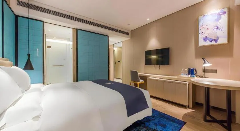 Bed in Echarm Hotel Kunming Railway Station Huancheng South Road Metro Station