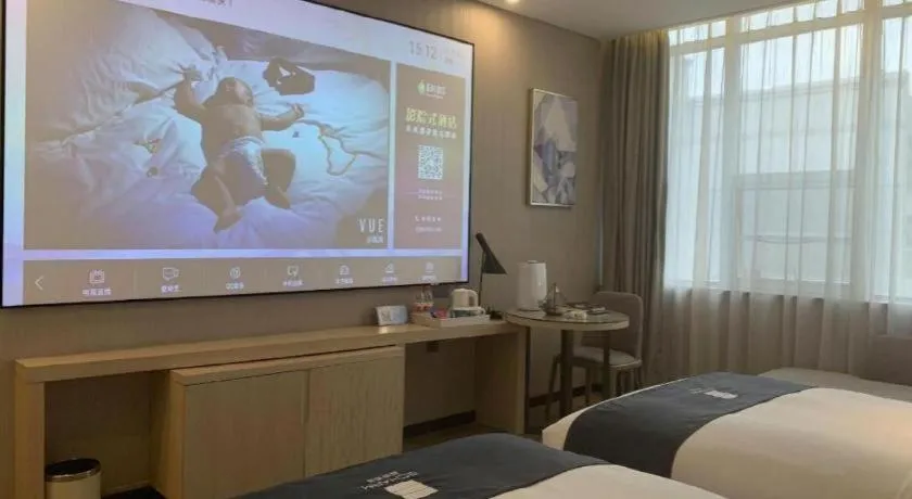 Bed in Echarm Hotel Kunming Railway Station Huancheng South Road Metro Station