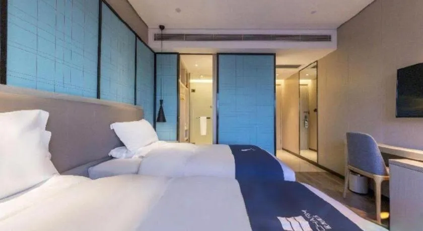 Bed in Echarm Hotel Kunming Railway Station Huancheng South Road Metro Station