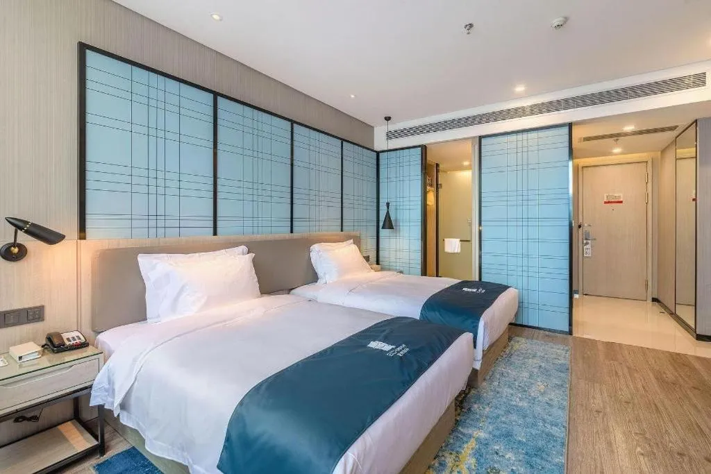 Bed in Echarm Hotel Kunming Railway Station Huancheng South Road Metro Station