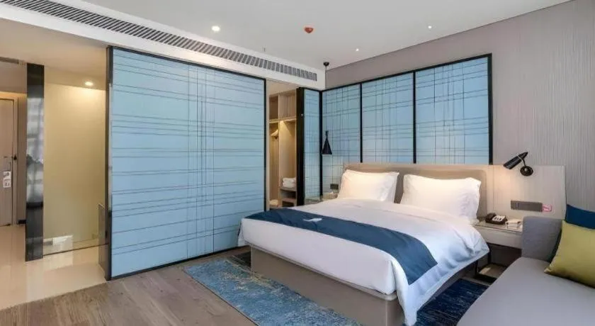 Bed in Echarm Hotel Kunming Railway Station Huancheng South Road Metro Station