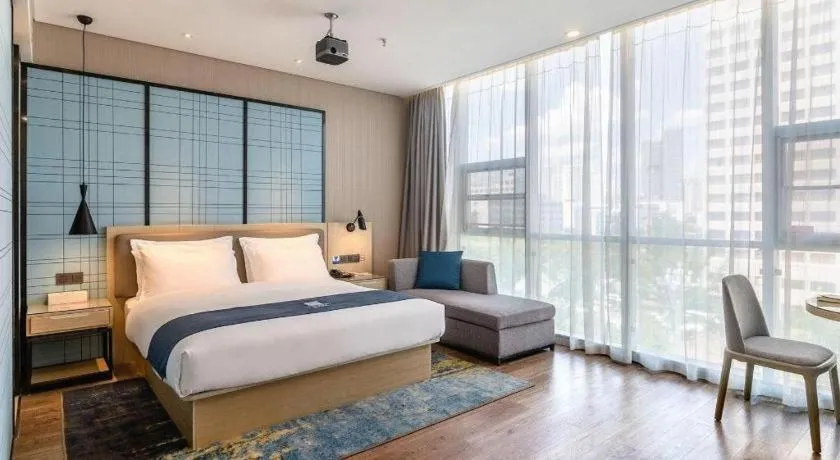 Bed in Echarm Hotel Kunming Railway Station Huancheng South Road Metro Station