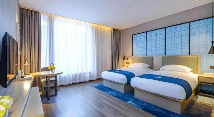 Bed in Echarm Hotel Kunming Railway Station Huancheng South Road Metro Station