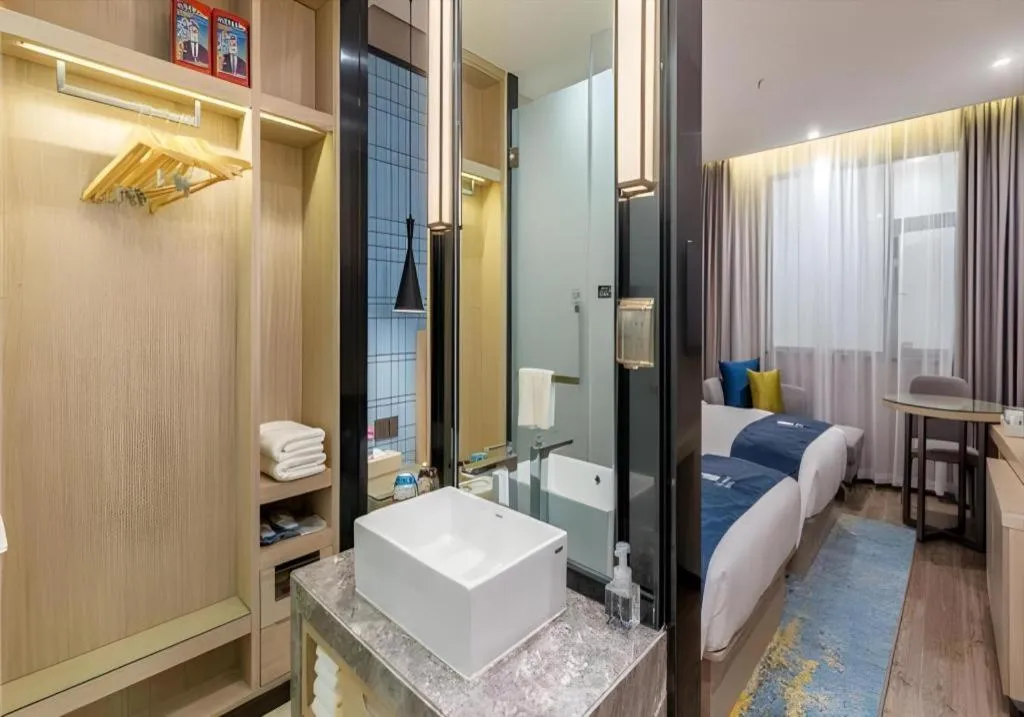 Bed in Echarm Hotel Kunming Railway Station Huancheng South Road Metro Station