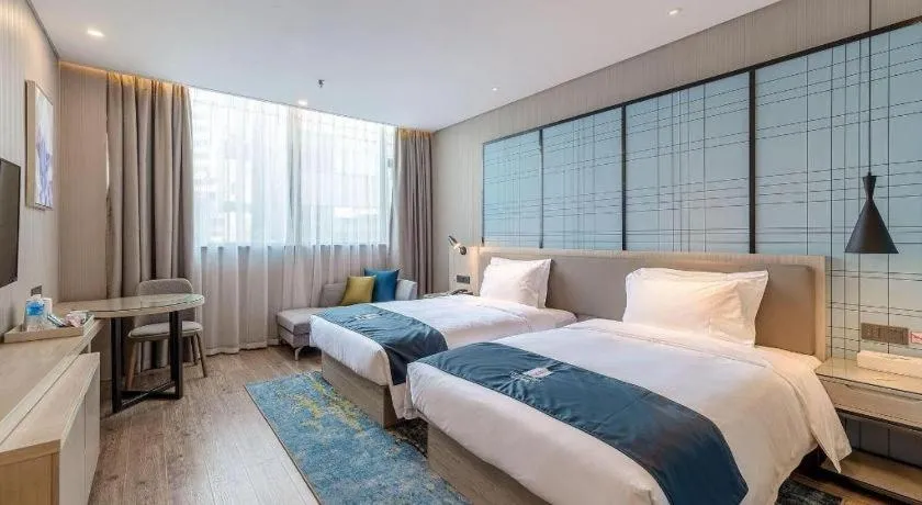 Bed in Echarm Hotel Kunming Railway Station Huancheng South Road Metro Station