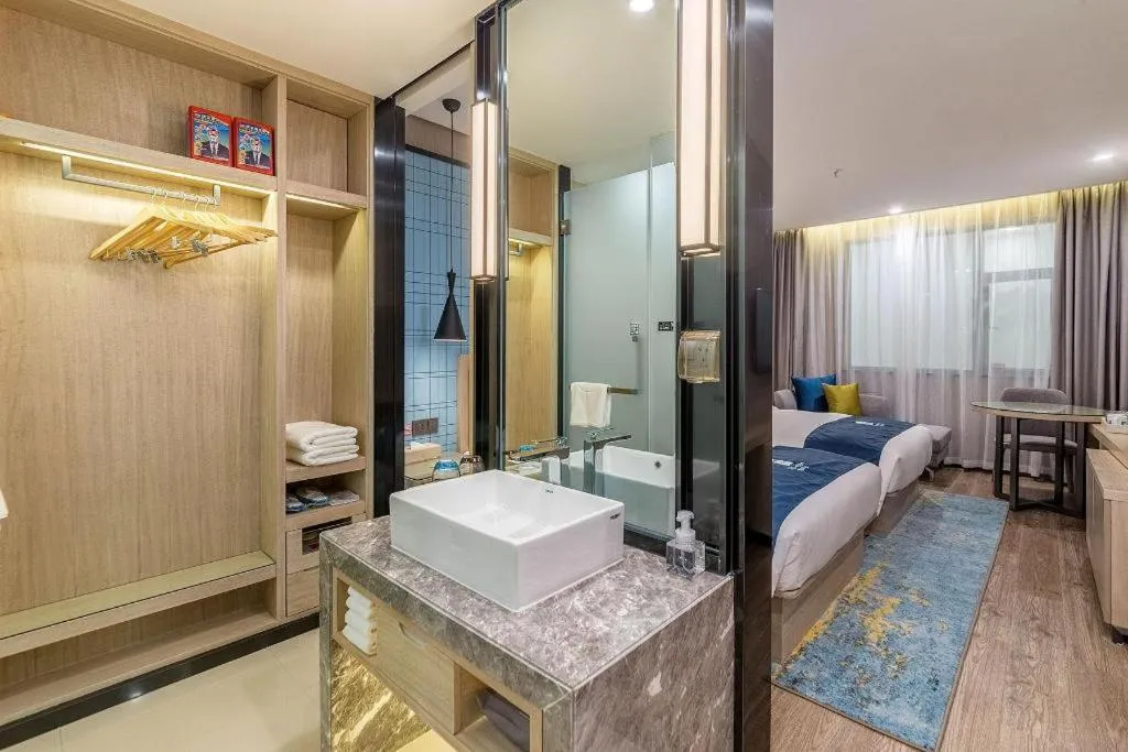 Bed in Echarm Hotel Kunming Railway Station Huancheng South Road Metro Station