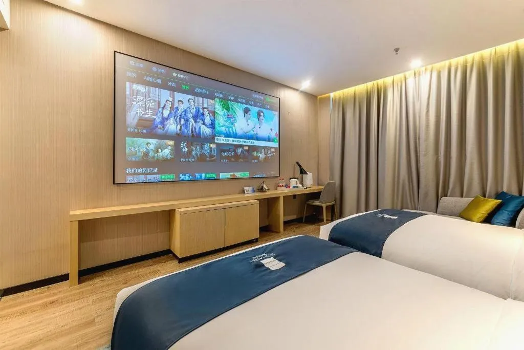 Bed in Echarm Hotel Kunming Railway Station Huancheng South Road Metro Station