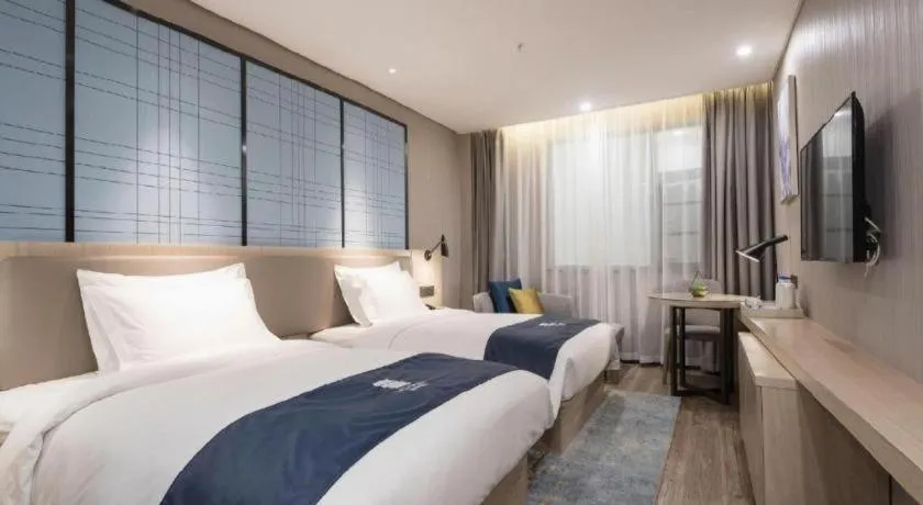 Bed in Echarm Hotel Kunming Railway Station Huancheng South Road Metro Station