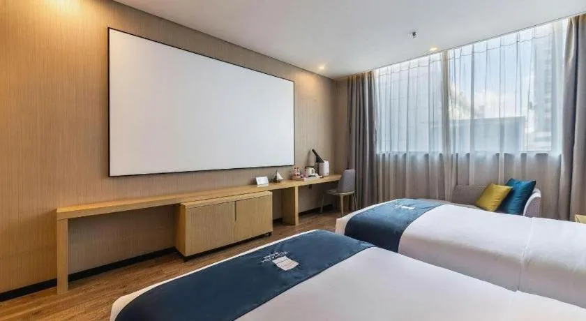 Bed in Echarm Hotel Kunming Railway Station Huancheng South Road Metro Station