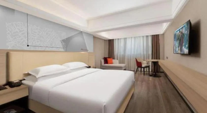 Bed in Borrman Hotel Guangzhou Railway Station Sanyuanli Metro Station