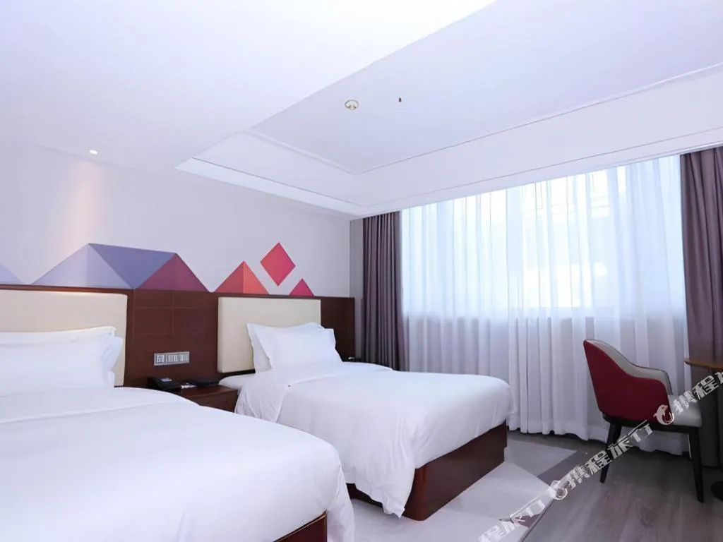 Bed in Borrman Hotel Guangzhou Railway Station Sanyuanli Metro Station