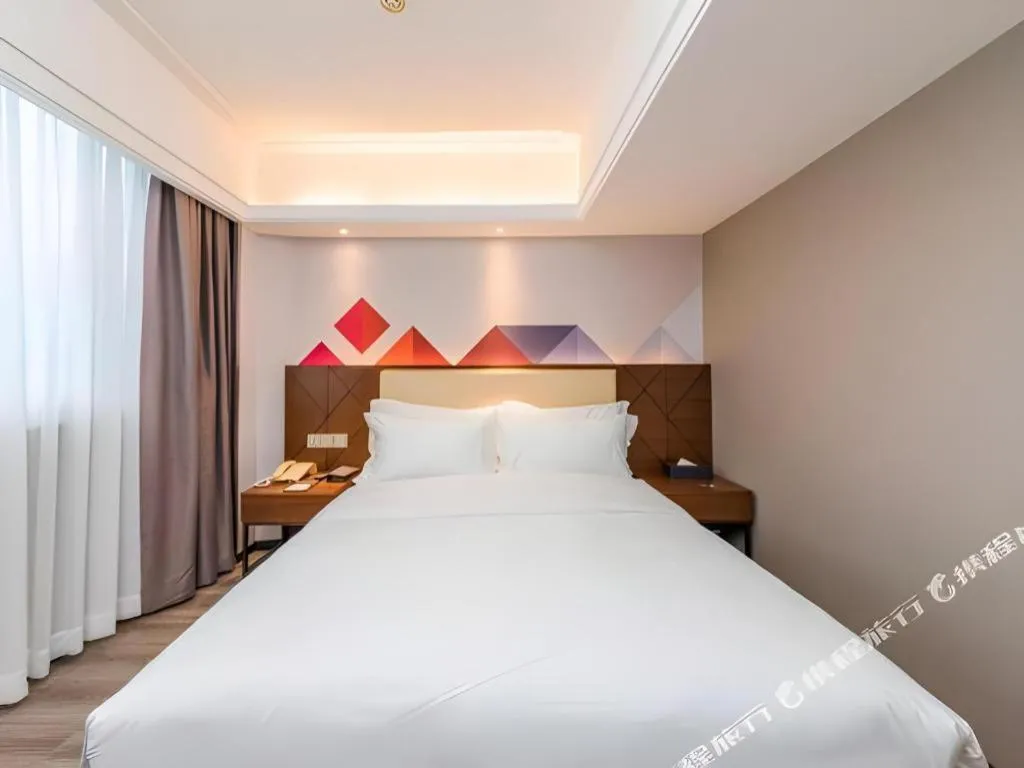 Bed in Borrman Hotel Guangzhou Railway Station Sanyuanli Metro Station