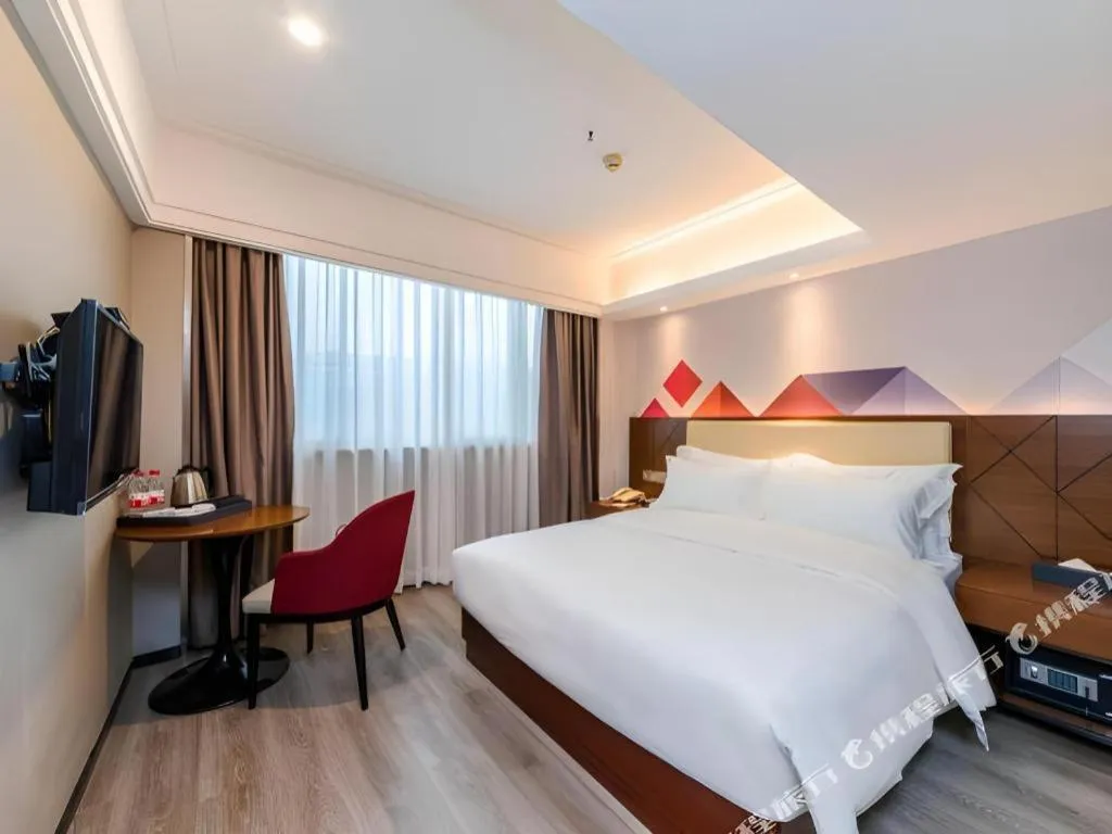 Bed in Borrman Hotel Guangzhou Railway Station Sanyuanli Metro Station