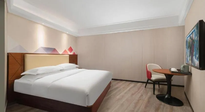 Bed in Borrman Hotel Guangzhou Railway Station Sanyuanli Metro Station