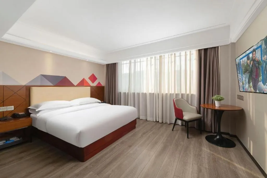 Bed in Borrman Hotel Guangzhou Railway Station Sanyuanli Metro Station