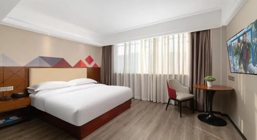 Bed in Borrman Hotel Guangzhou Railway Station Sanyuanli Metro Station