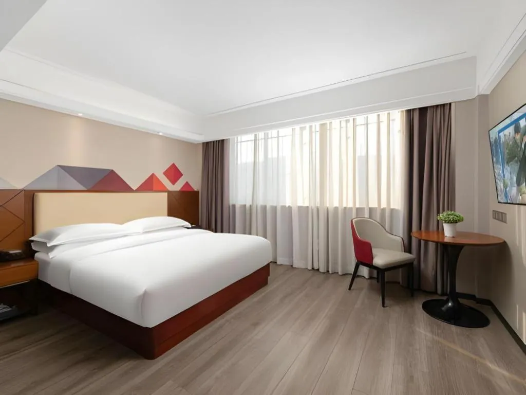 Bed in Borrman Hotel Guangzhou Railway Station Sanyuanli Metro Station