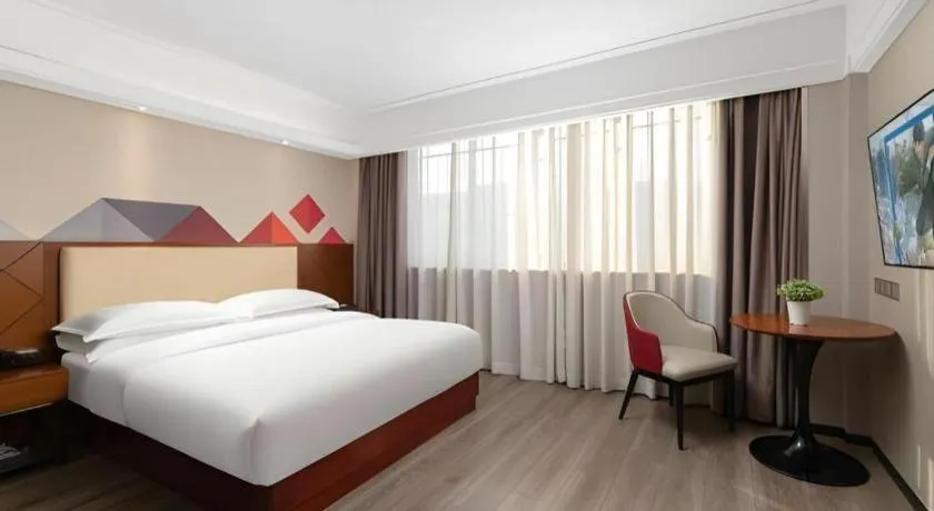 Bed in Borrman Hotel Guangzhou Railway Station Sanyuanli Metro Station