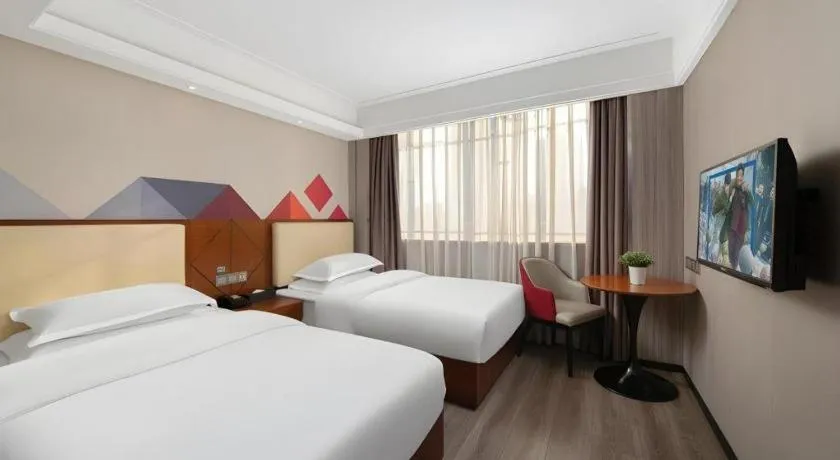 Bed in Borrman Hotel Guangzhou Railway Station Sanyuanli Metro Station