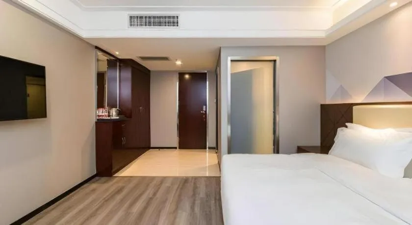 Bed in Borrman Hotel Guangzhou Railway Station Sanyuanli Metro Station