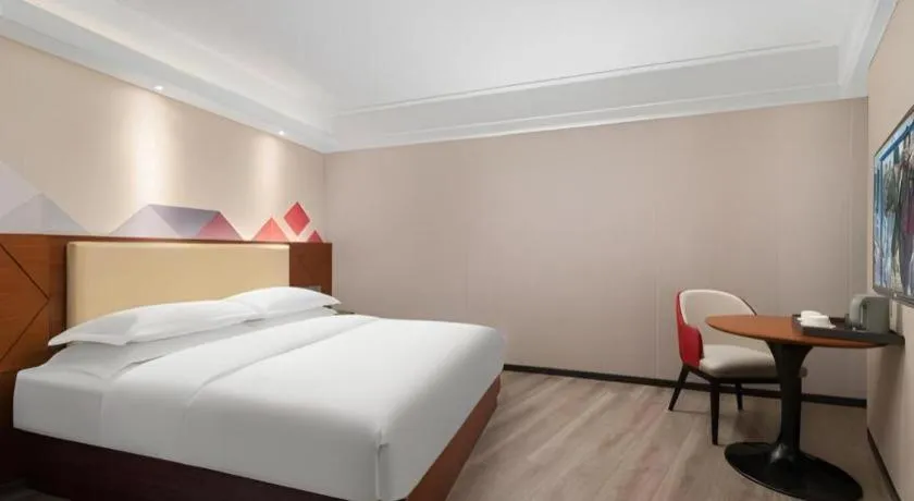 Bed in Borrman Hotel Guangzhou Railway Station Sanyuanli Metro Station