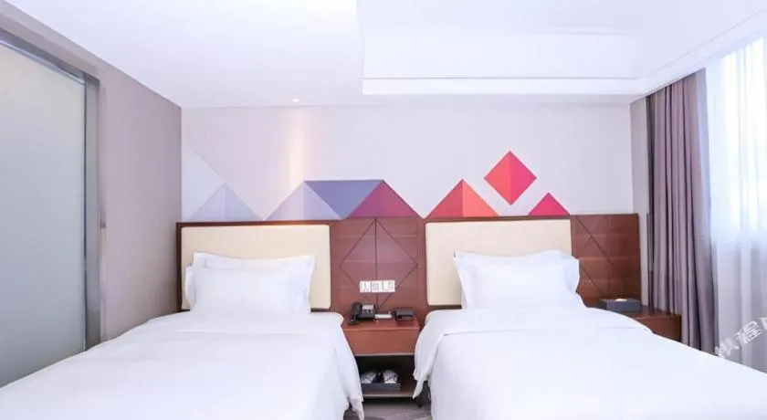 Bed in Borrman Hotel Guangzhou Railway Station Sanyuanli Metro Station