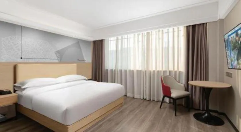 Bed in Borrman Hotel Guangzhou Railway Station Sanyuanli Metro Station